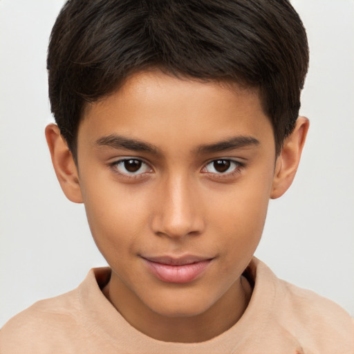 Joyful white child male with short  brown hair and brown eyes