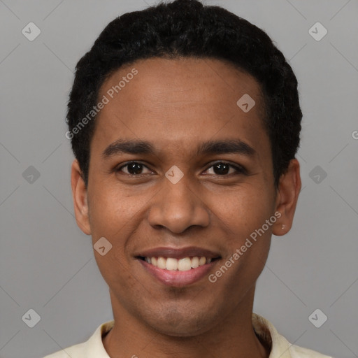 Joyful black young-adult male with short  black hair and brown eyes