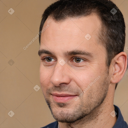 Joyful white adult male with short  brown hair and brown eyes