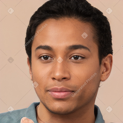 Joyful latino young-adult male with short  black hair and brown eyes