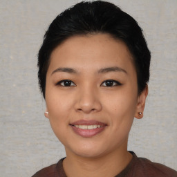 Joyful asian young-adult female with short  black hair and brown eyes