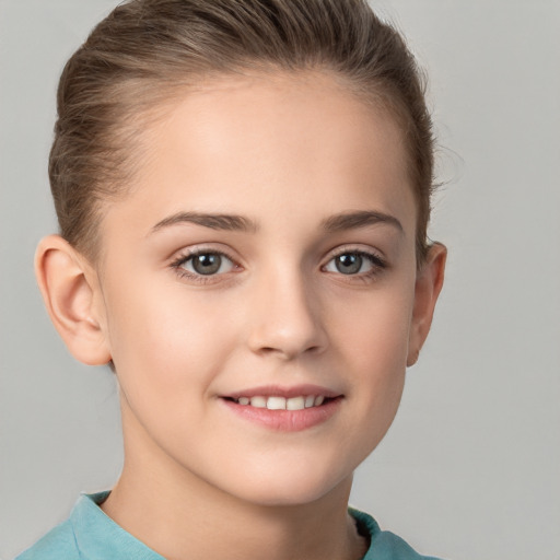 Joyful white child female with short  brown hair and brown eyes