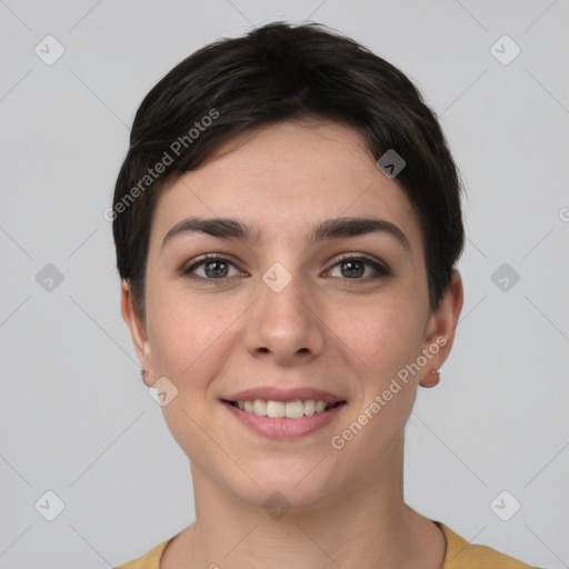 Joyful white young-adult female with short  brown hair and brown eyes