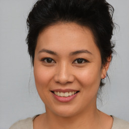 Joyful asian young-adult female with short  brown hair and brown eyes