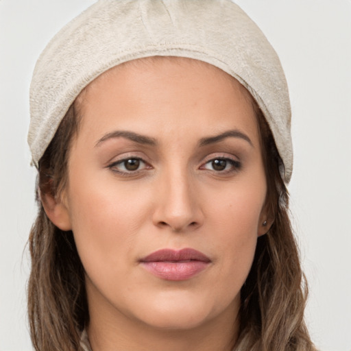 Joyful white young-adult female with long  brown hair and brown eyes