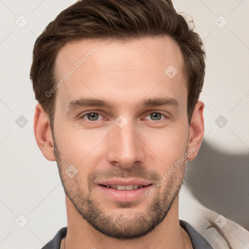 Joyful white young-adult male with short  brown hair and grey eyes