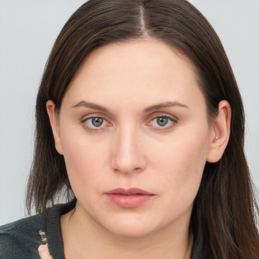 Neutral white young-adult female with long  brown hair and grey eyes