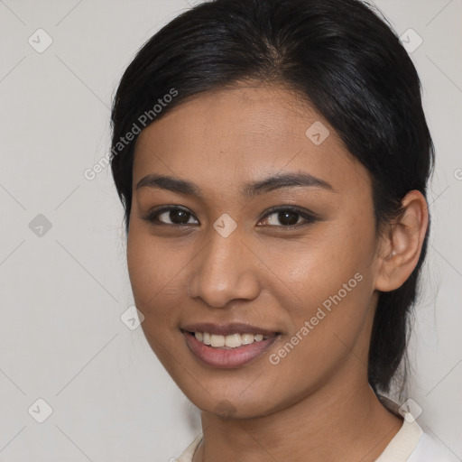 Joyful asian young-adult female with medium  brown hair and brown eyes