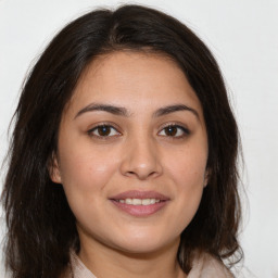 Joyful white young-adult female with medium  brown hair and brown eyes