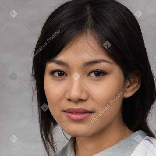 Joyful asian young-adult female with medium  black hair and brown eyes