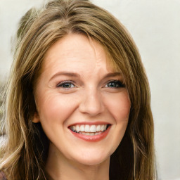 Joyful white young-adult female with long  brown hair and green eyes