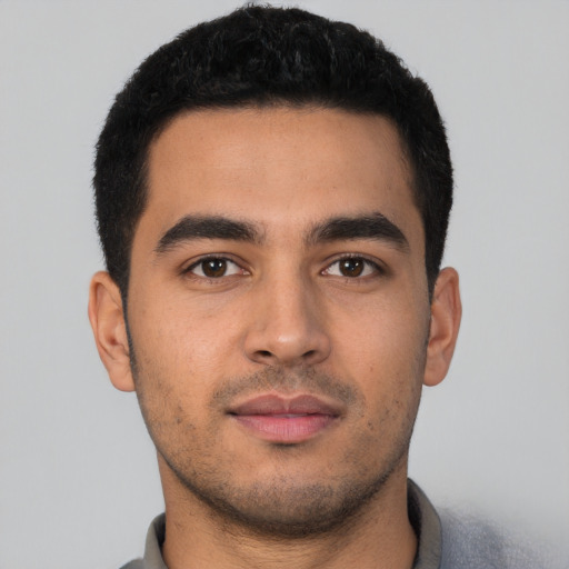 Neutral latino young-adult male with short  black hair and brown eyes