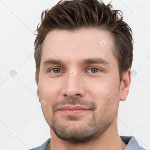 Neutral white young-adult male with short  brown hair and brown eyes