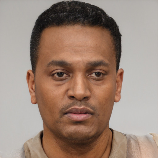 Neutral black young-adult male with short  black hair and brown eyes