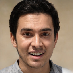 Joyful white young-adult male with short  black hair and brown eyes