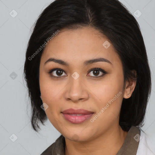 Joyful latino young-adult female with medium  brown hair and brown eyes