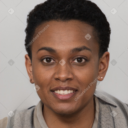 Joyful black young-adult female with short  brown hair and brown eyes