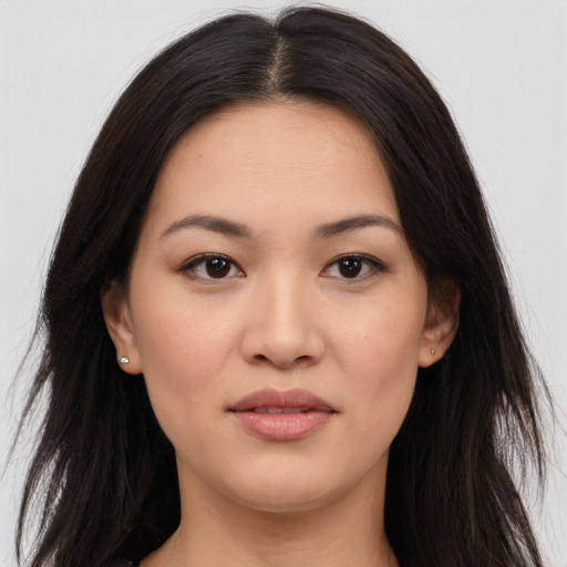Joyful asian young-adult female with long  brown hair and brown eyes