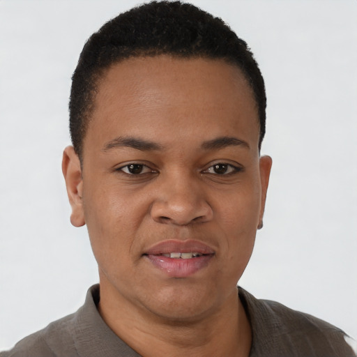 Joyful black young-adult male with short  black hair and brown eyes