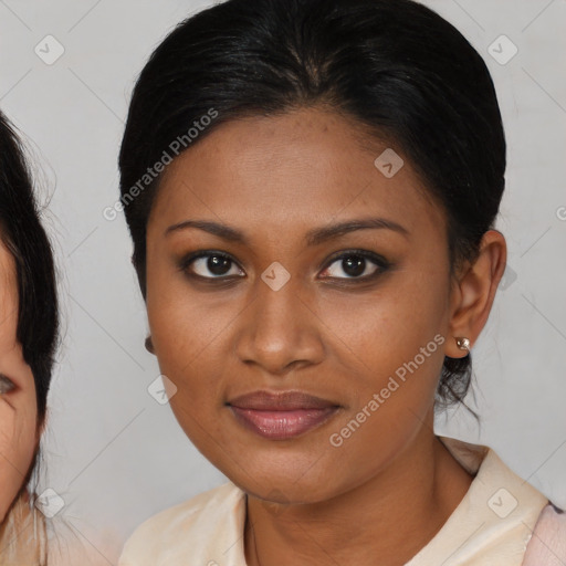 Joyful black young-adult female with medium  brown hair and brown eyes