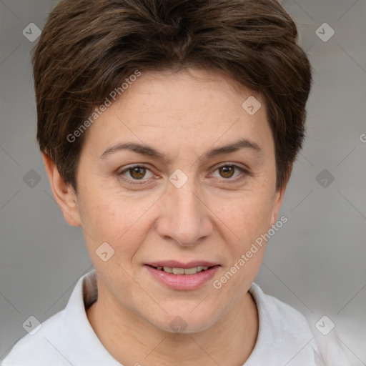 Joyful white adult female with short  brown hair and brown eyes