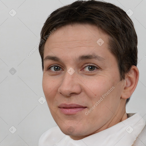 Joyful white adult male with short  brown hair and brown eyes