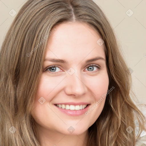 Joyful white young-adult female with long  brown hair and green eyes