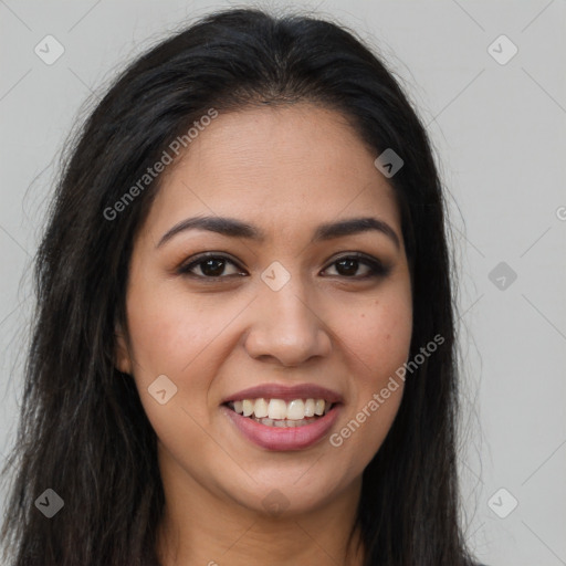 Joyful latino young-adult female with long  brown hair and brown eyes