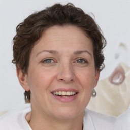 Joyful white adult female with short  brown hair and brown eyes