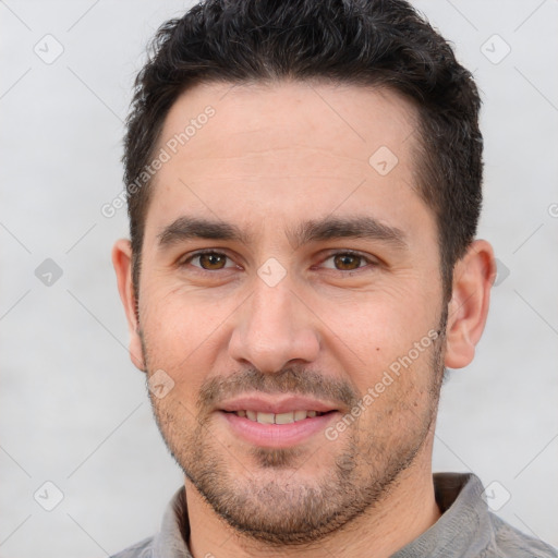 Joyful white young-adult male with short  brown hair and brown eyes