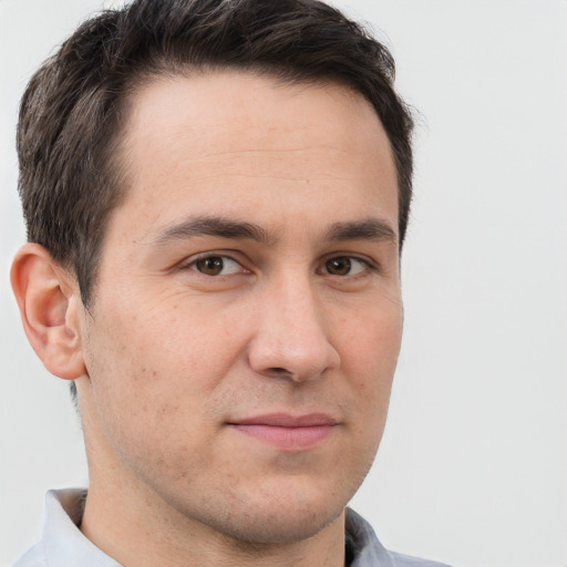 Joyful white adult male with short  brown hair and brown eyes