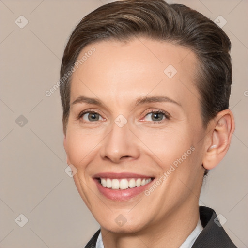 Joyful white adult female with medium  brown hair and brown eyes