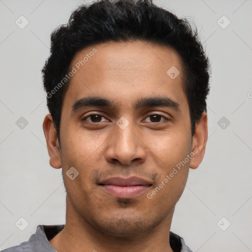 Joyful latino young-adult male with short  black hair and brown eyes