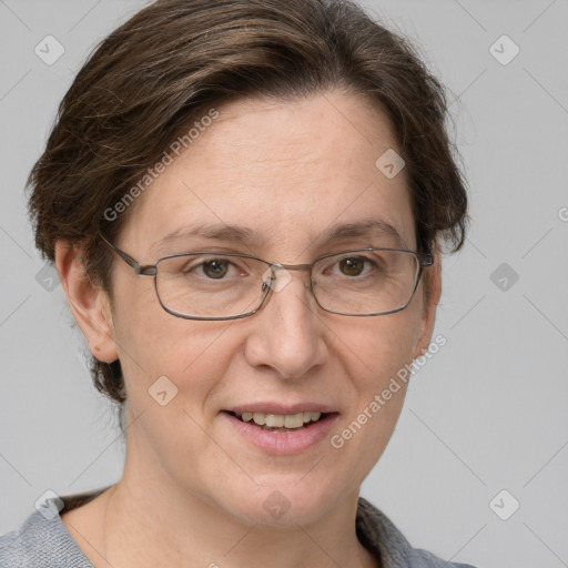 Joyful white adult female with short  brown hair and grey eyes