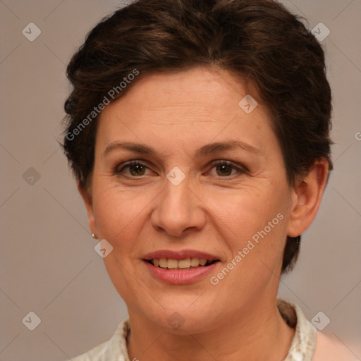 Joyful white adult female with short  brown hair and brown eyes