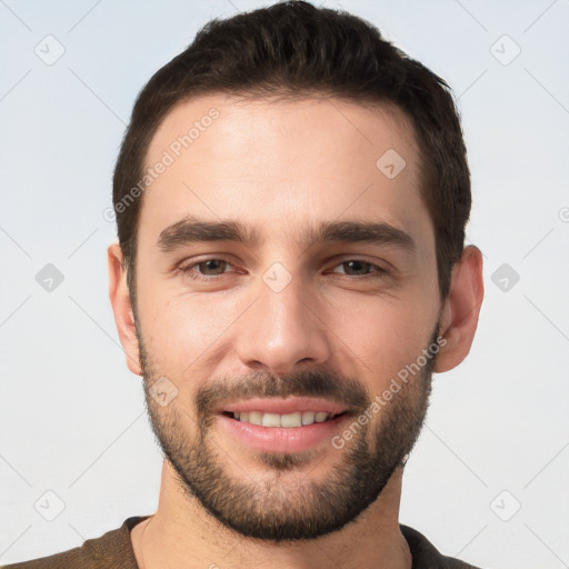 Joyful white young-adult male with short  brown hair and brown eyes