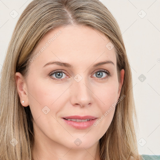 Joyful white young-adult female with long  brown hair and blue eyes