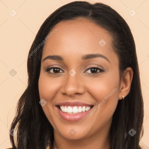 Joyful latino young-adult female with long  brown hair and brown eyes