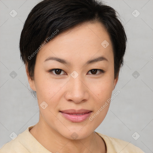 Joyful asian young-adult female with short  brown hair and brown eyes