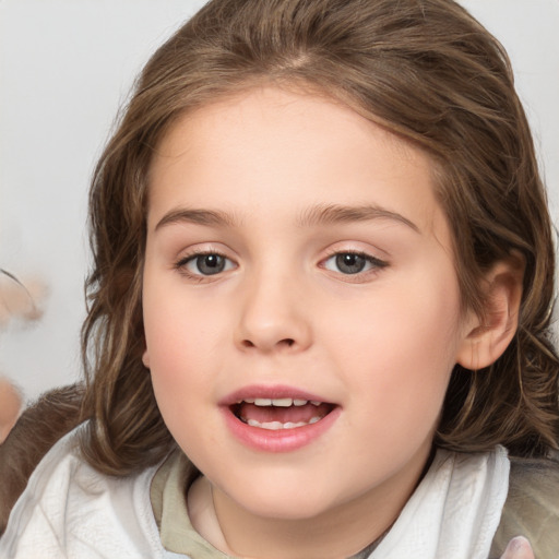 Joyful white child female with medium  brown hair and brown eyes