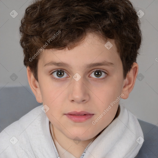 Joyful white child male with short  brown hair and brown eyes