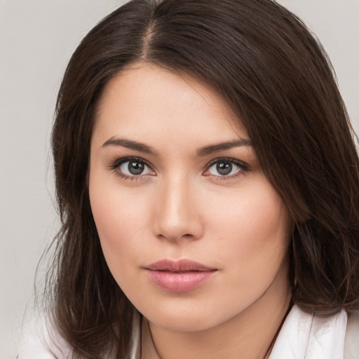 Neutral white young-adult female with medium  brown hair and brown eyes