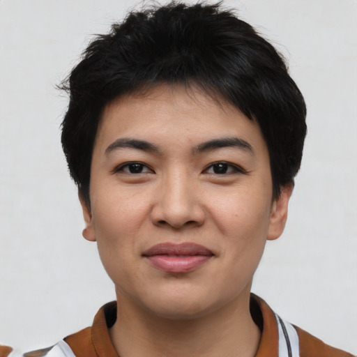Joyful asian young-adult female with short  black hair and brown eyes