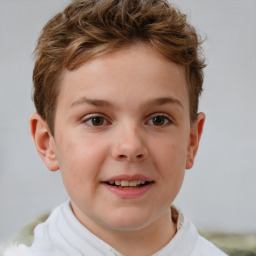 Joyful white child male with short  brown hair and brown eyes