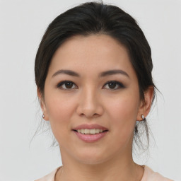 Joyful asian young-adult female with medium  brown hair and brown eyes