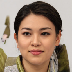 Joyful asian young-adult female with medium  brown hair and brown eyes