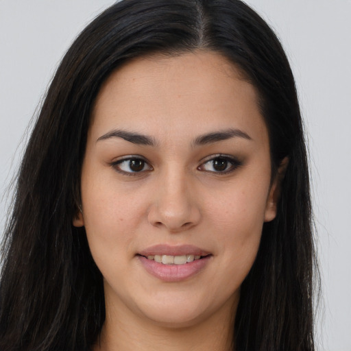 Joyful asian young-adult female with long  brown hair and brown eyes