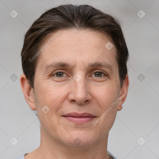 Joyful white adult male with short  brown hair and grey eyes