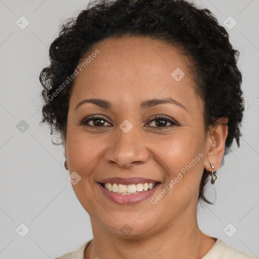 Joyful latino adult female with short  brown hair and brown eyes