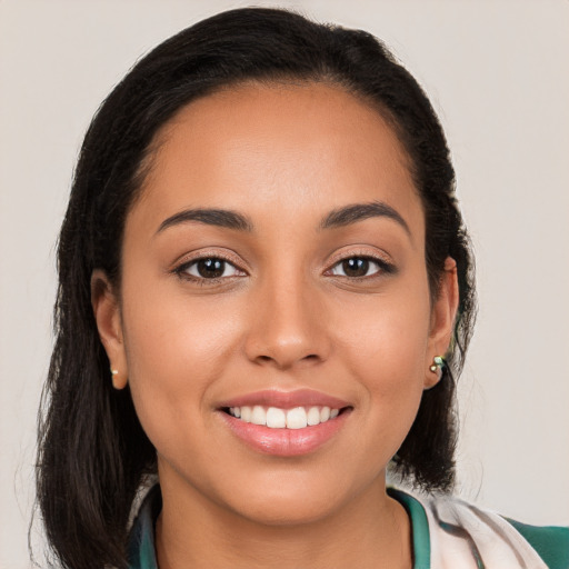 Joyful white young-adult female with long  brown hair and brown eyes